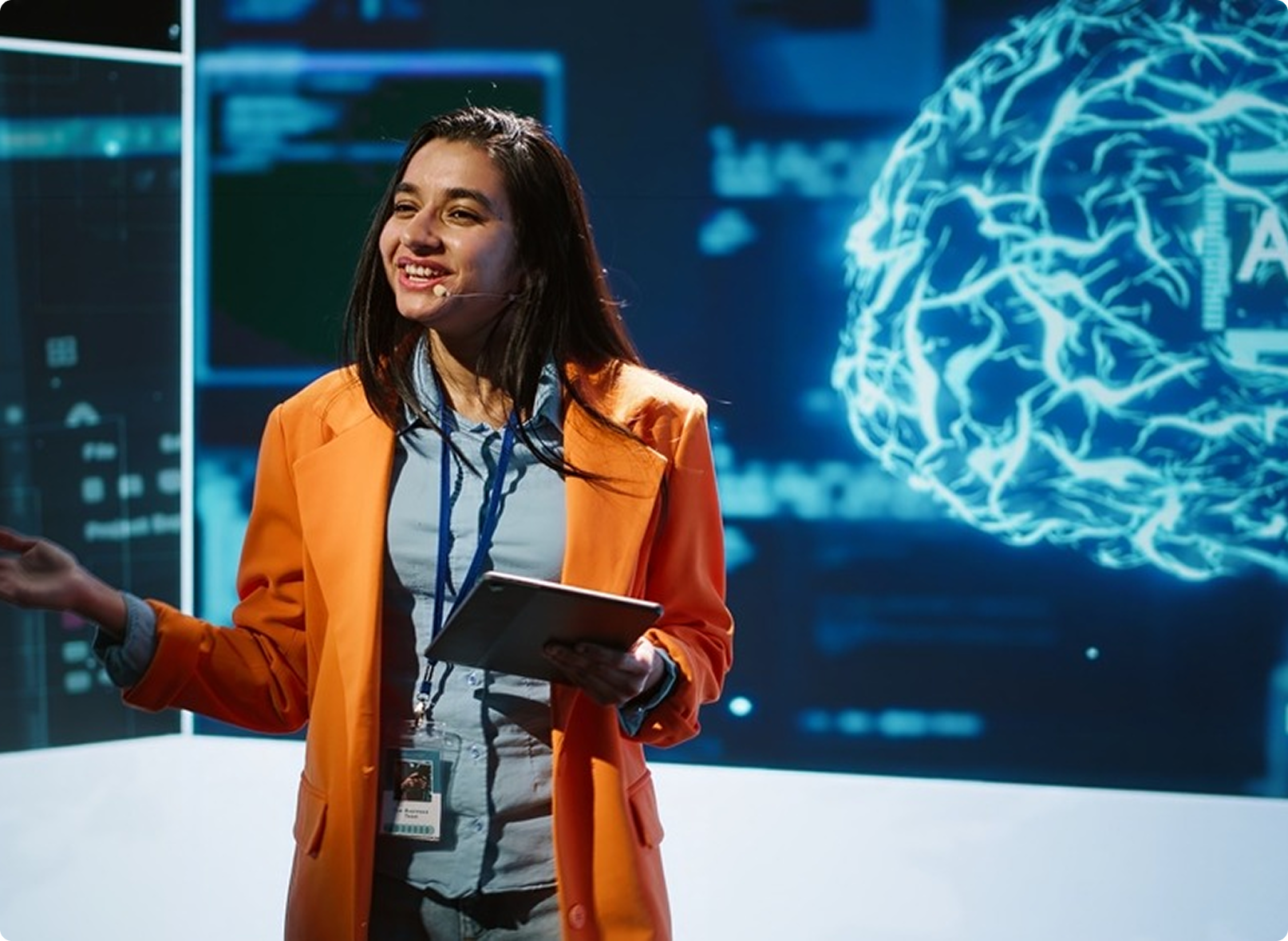 Speaker presenting in front of 3D digital brain graphic