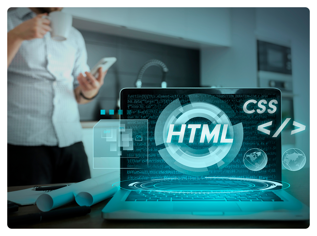 Laptop displaying HTML CSS code graphics with coffee cup in background